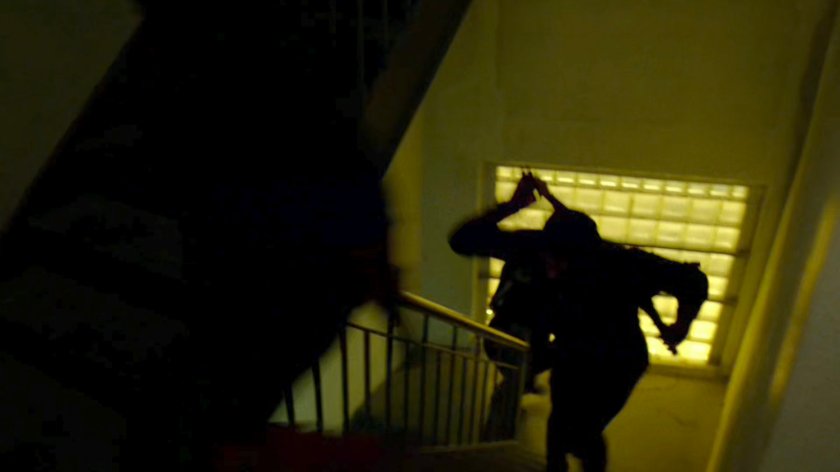 Ninjas run upstairs in abandoned warehouse.