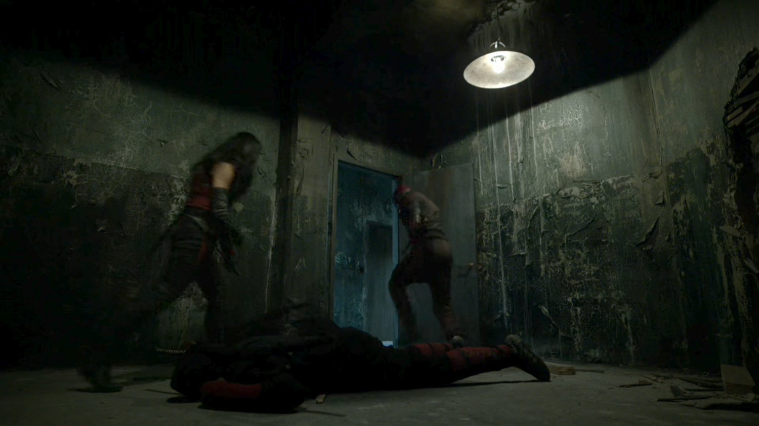 Elektra and Daredevil in abandoned warehouse.