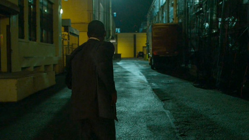 Brett Mahoney in an alley outside abandoned warehouse.