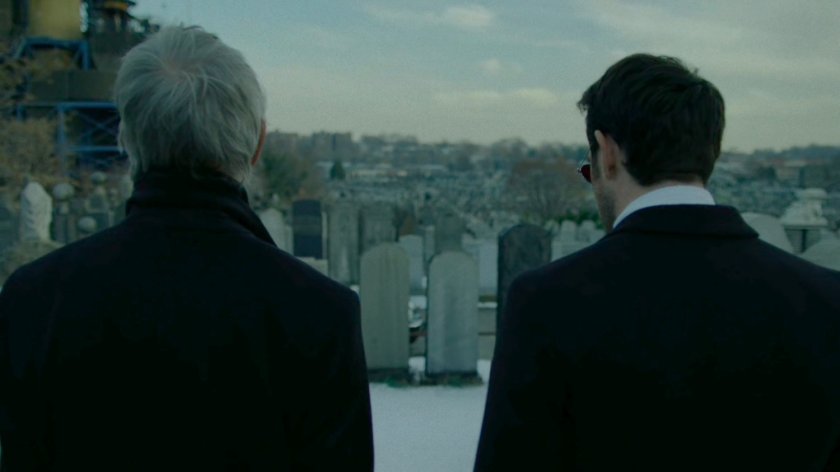 Stick and Matt at a snowy cemetery.