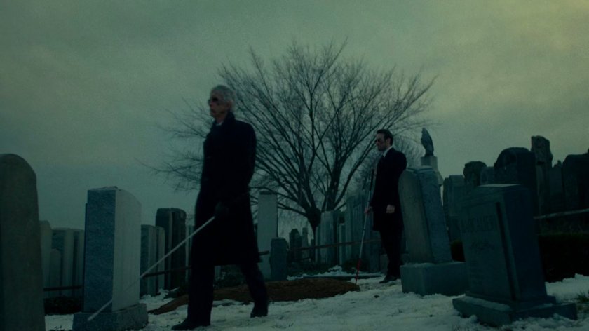 Stick and Matt at a snowy cemetery.