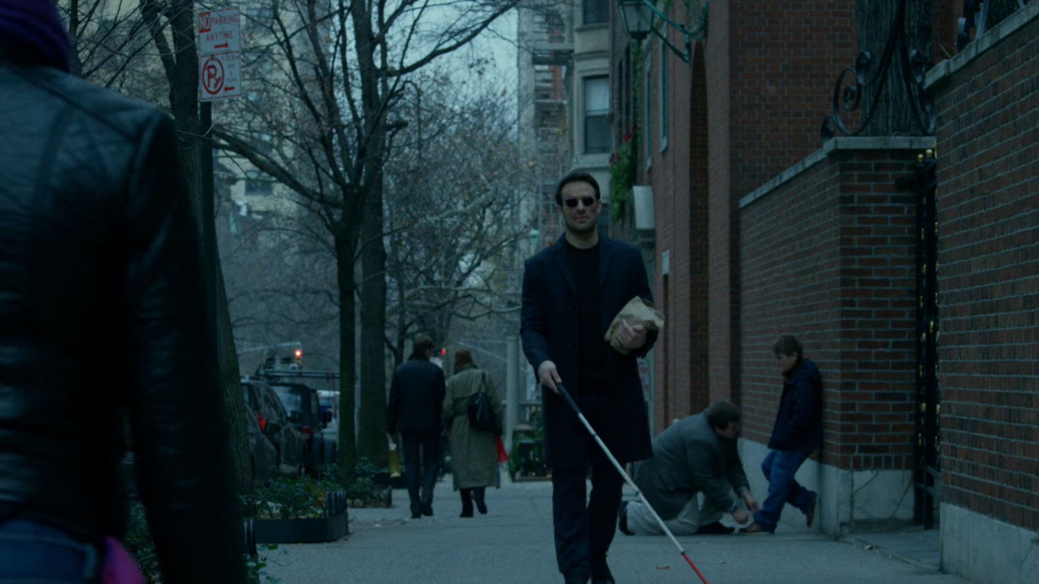 Matt walking along a sidewalk.