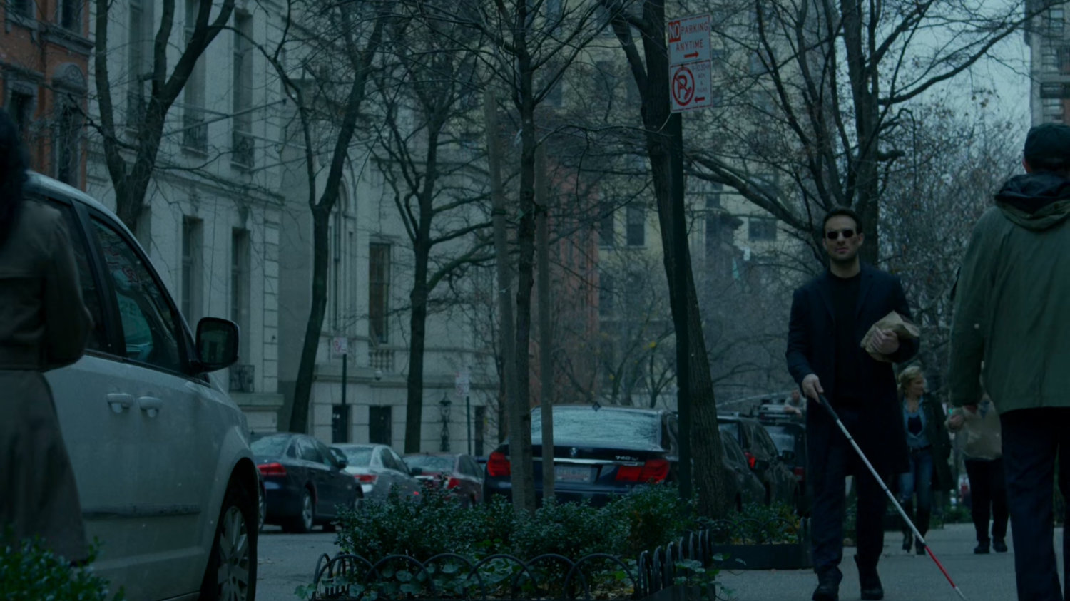 Matt walking along a sidewalk.