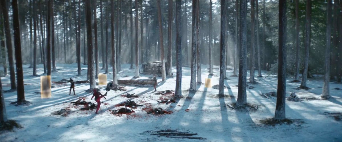 Deadpool fighting TVA agents in snowy North Dakota woods.