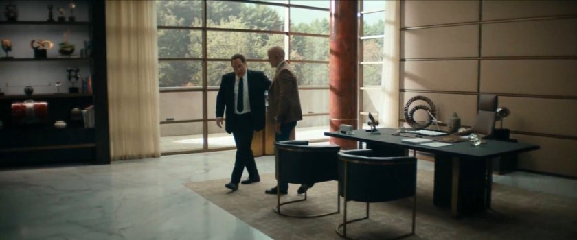 Wade Wilson and Happy Hogan in Happy's office.