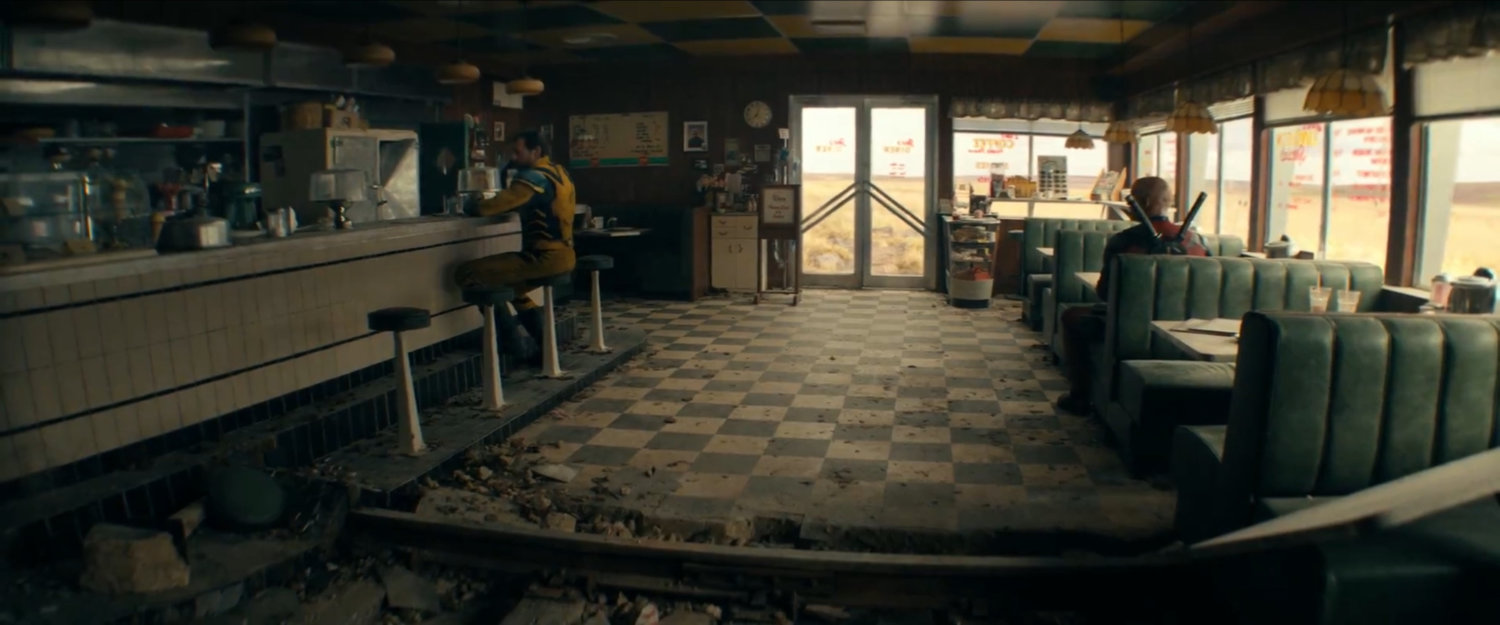 Deadpool and Wolverine inside Joe's Diner.