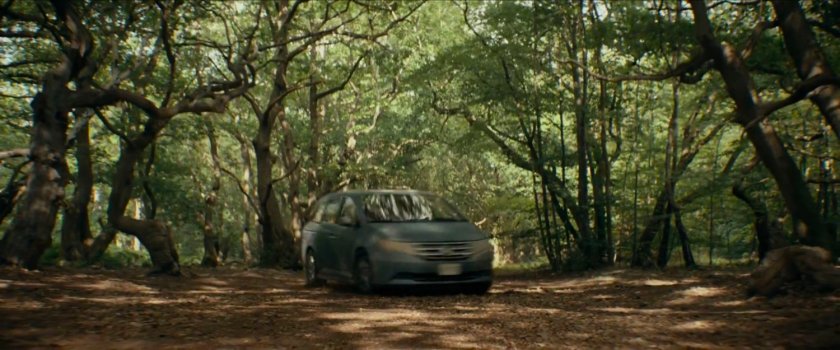 Minivan driving through woods in The Void's Borderlands.