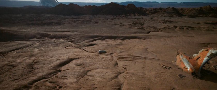 Minivan driving across the top of a mesa in the Void.