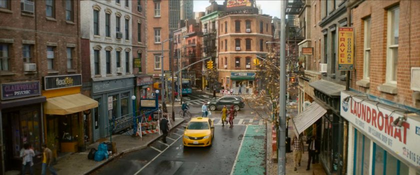 Deadpool and Wolverine on city street.