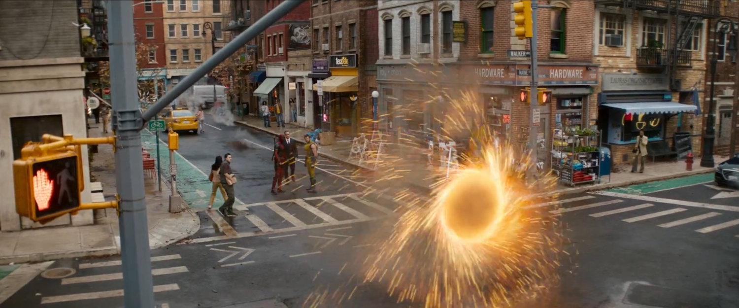 A magic portal appears at intersection of city streets.