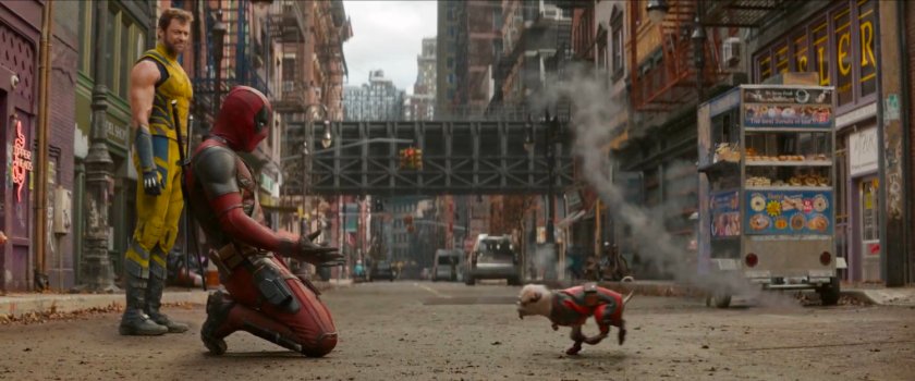 Wolverine watches Deadpool call Dogpool to him on city street.