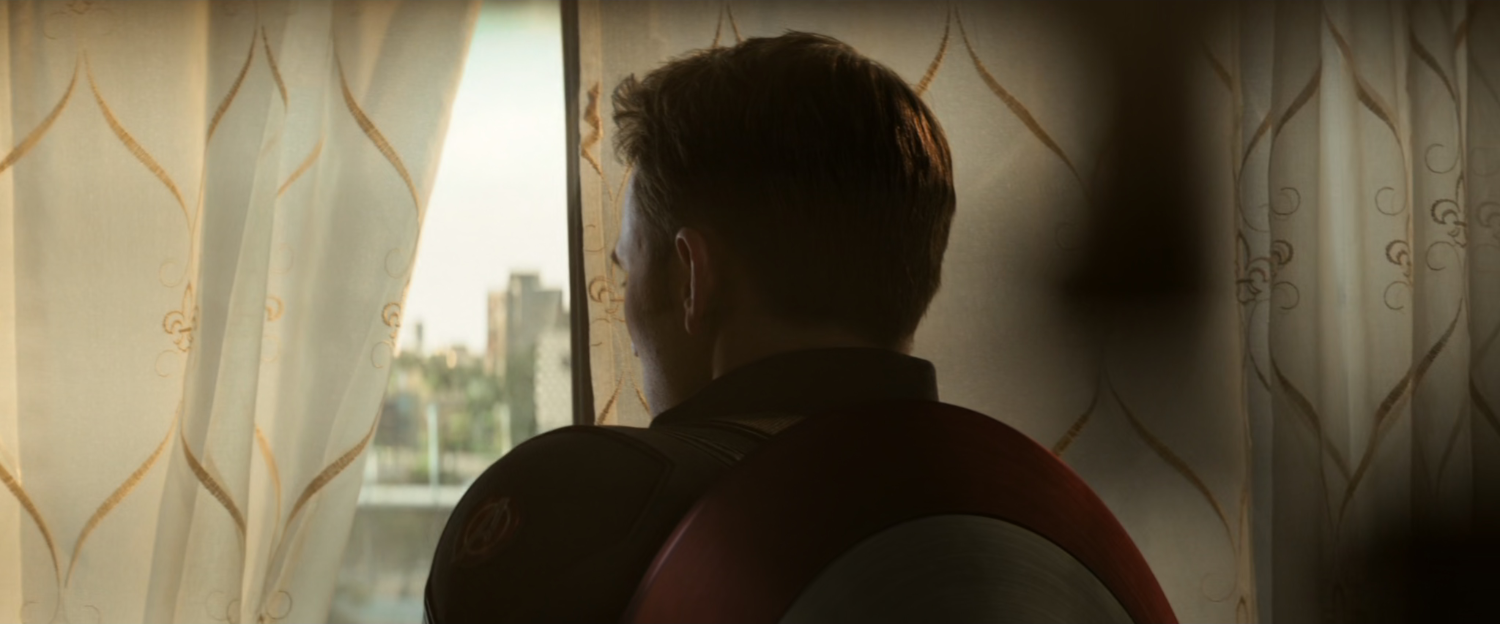 Steve looking out a window in Lagos building.