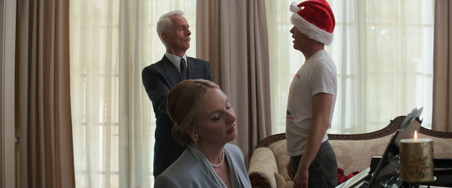 Howard and Maria Stark and a young Tony in their living room.