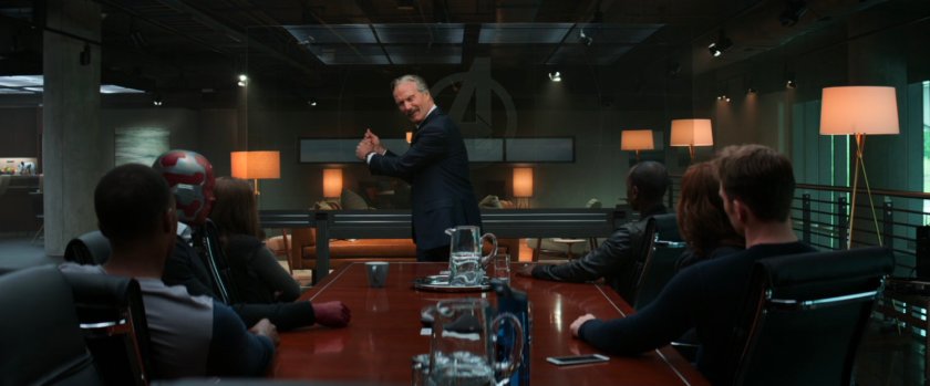 Secretary Ross speaks to the Avengers in the conference room of their HQ.
