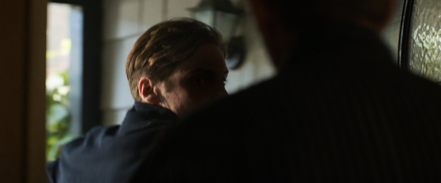 Zemo pushes his way into Vasily Karpov's house.