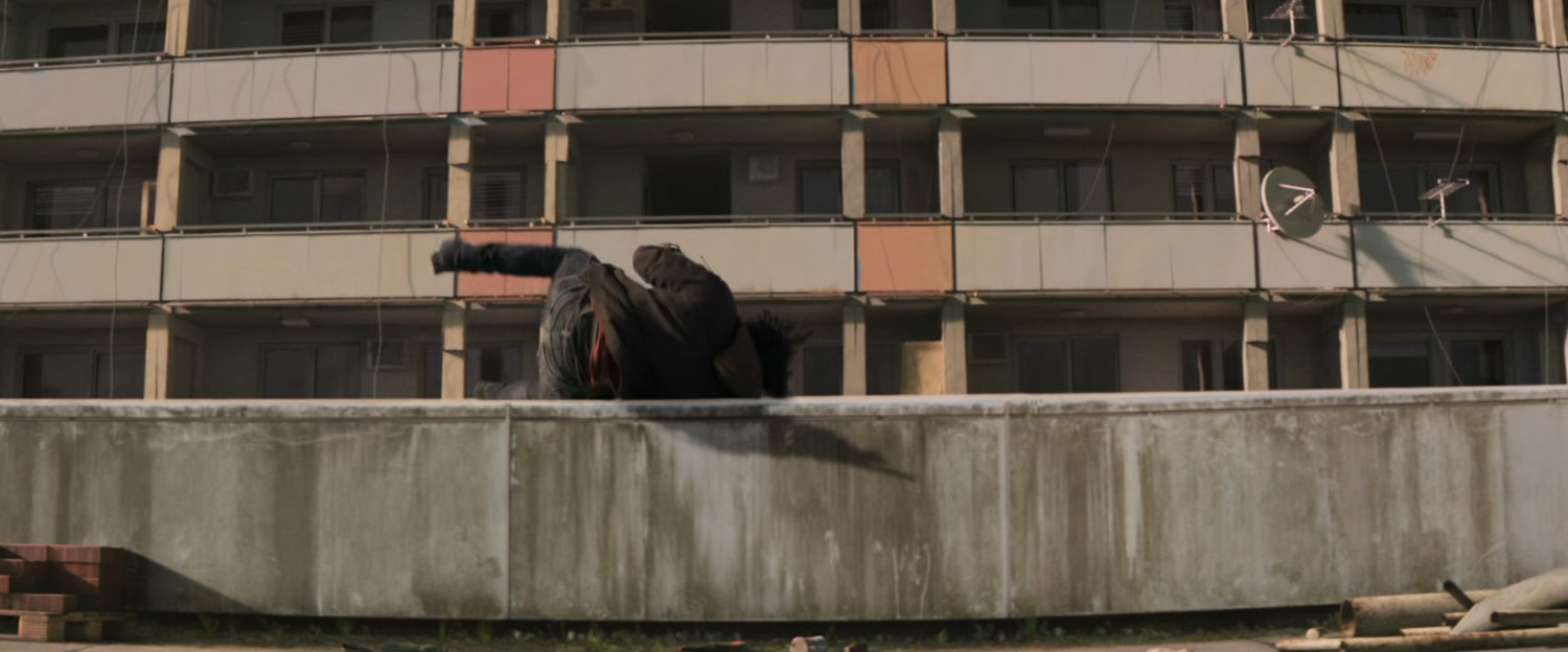 Bucky lands on rooftop of building in Bucharest.