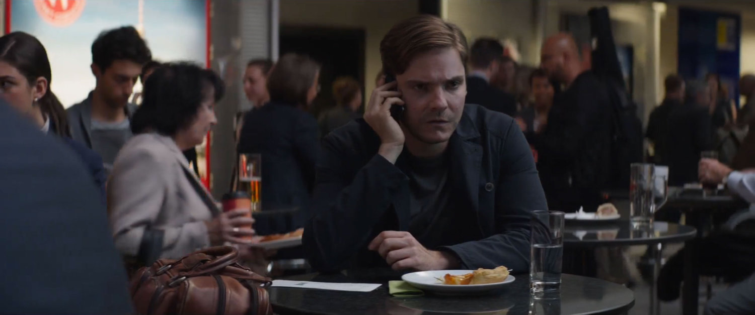 Zemo on a cell phone in the Berlin airport.