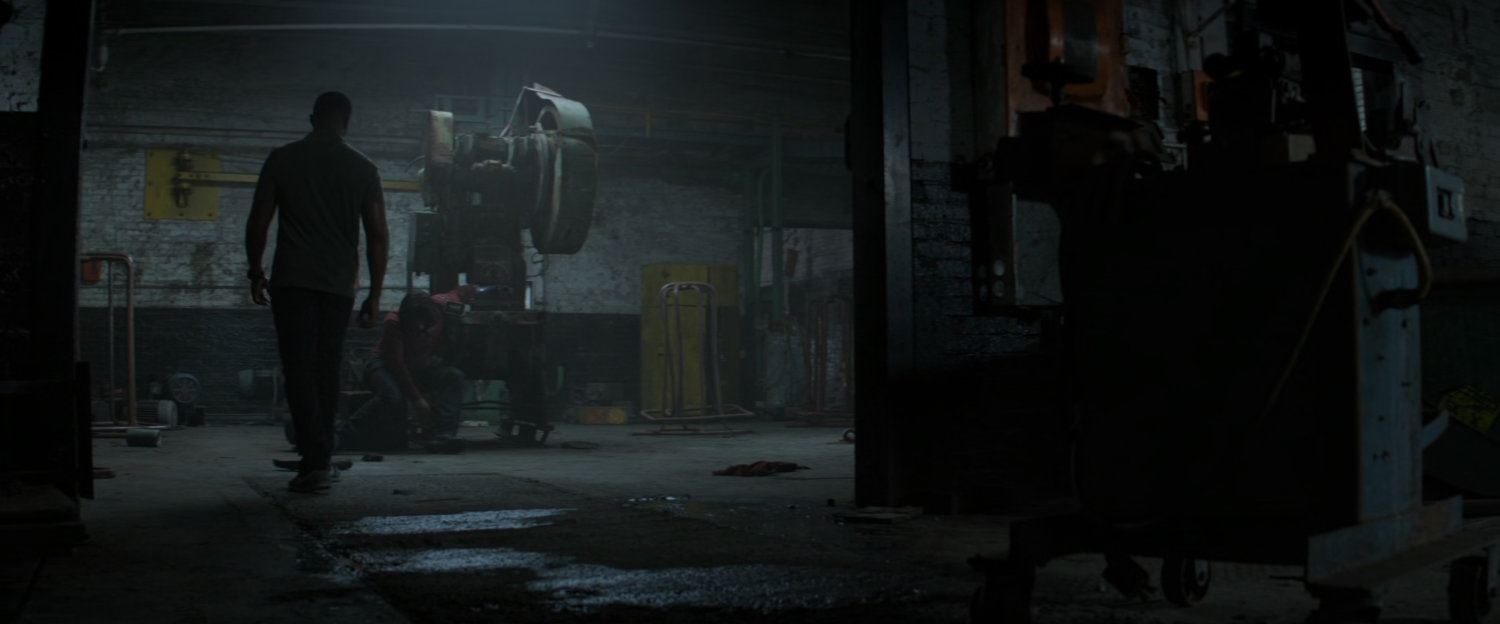 Steve approaches Bucky in a dilapidated Berlin warehouse.