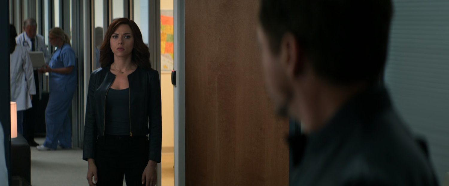 Natasha and Tony in a hospital hallway.