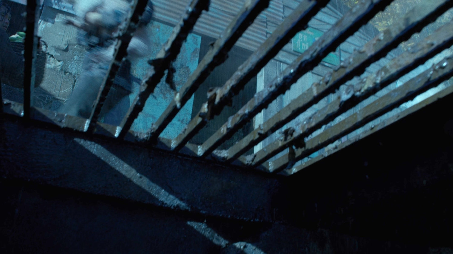 View through grate in the sewers of Phnom Penh.
