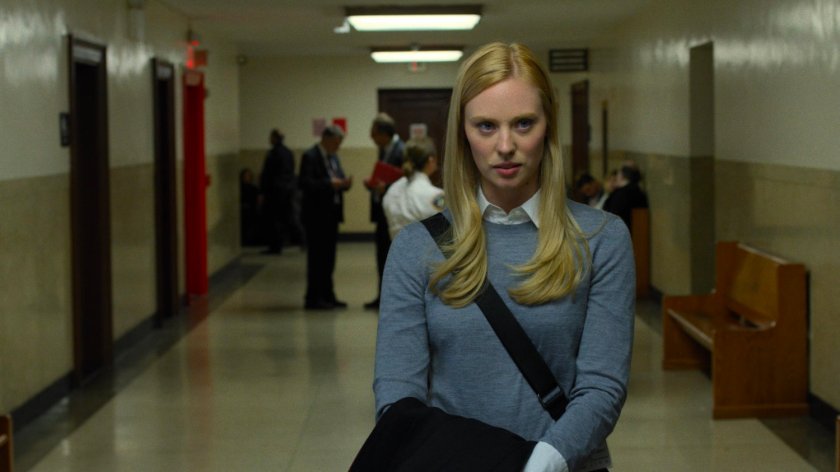 Karen Page in a court house hallway.