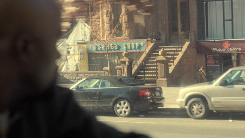 View from city bus of the Pop's Barber Shop in Harlem.