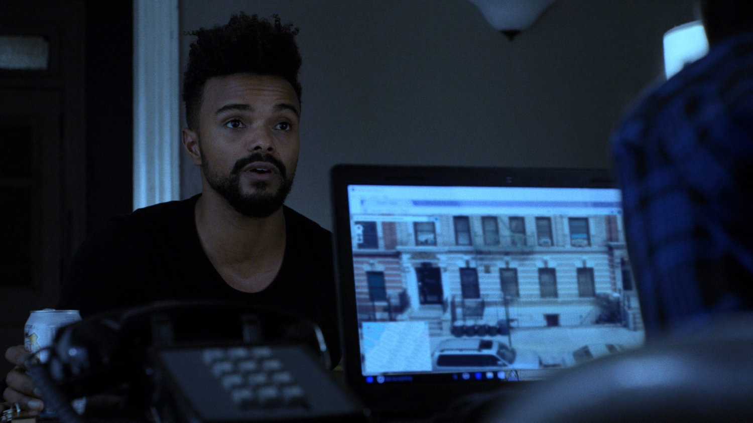 Google street view on computer screen next to Malcolm.