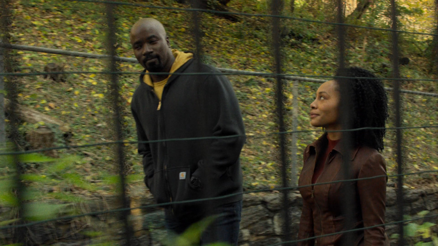 Luke and Misty walk along Harlem alley.