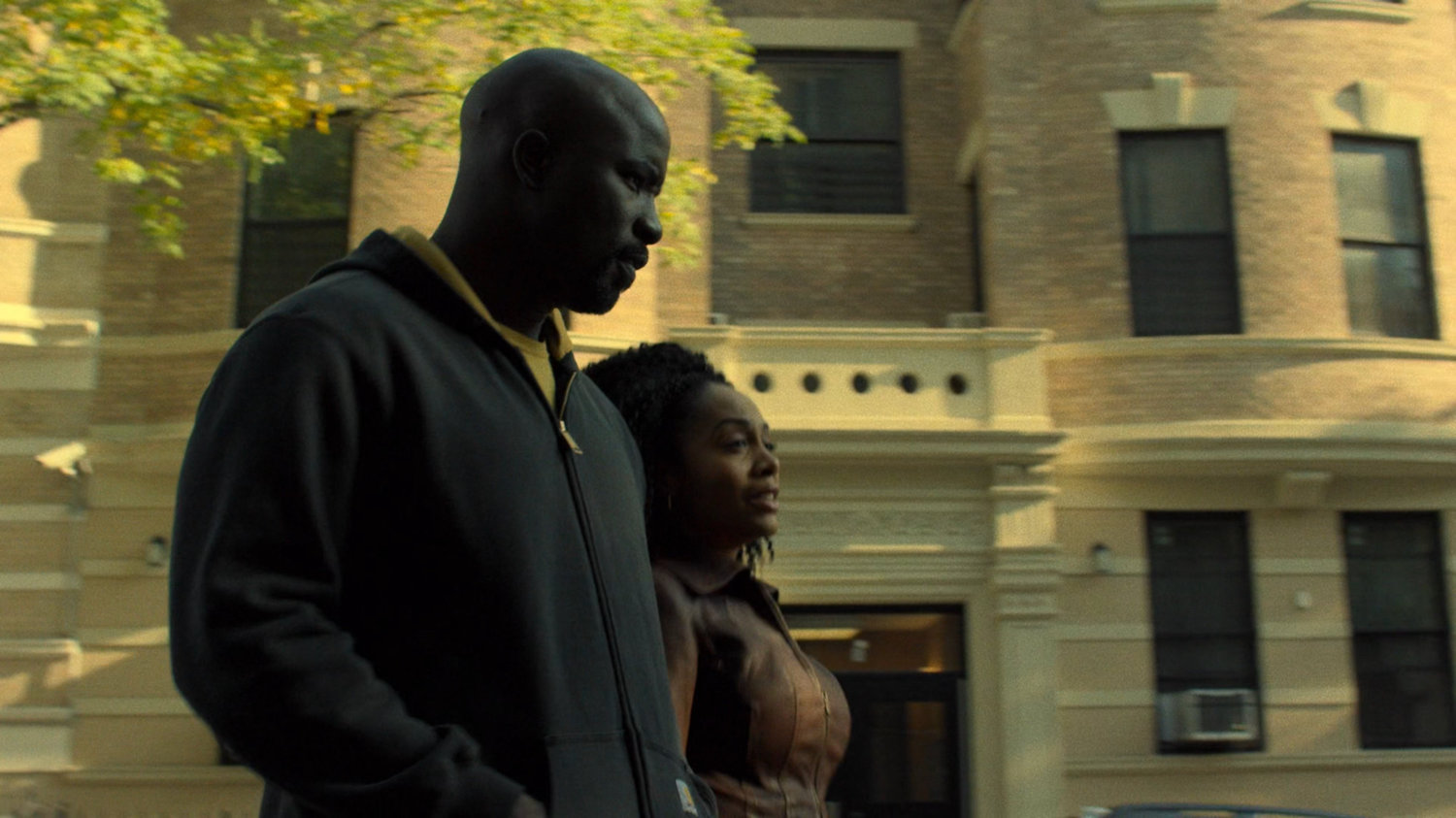 Luke and Misty walk along Harlem street.