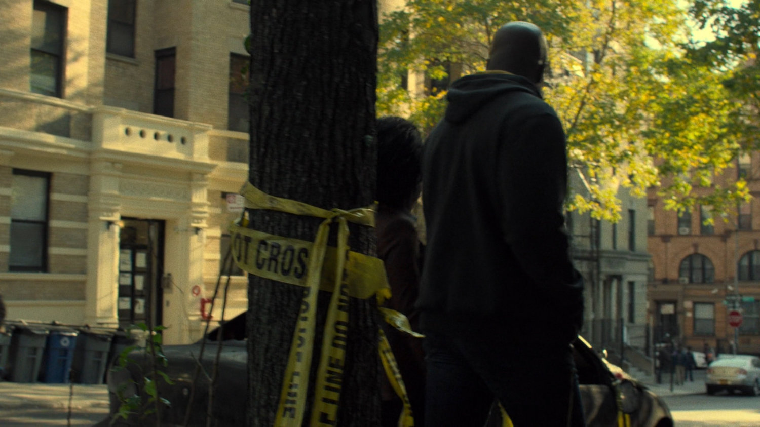 Luke and Misty walk past Harlem memorial.