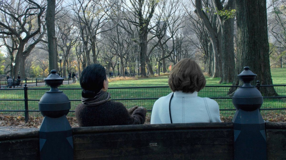 Alexandra and Madame Gao sitting on bench in Central Park.