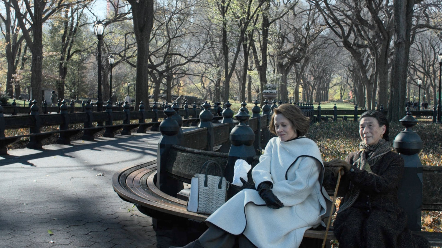 Alexandra and Madame Gao sitting on bench in Central Park.
