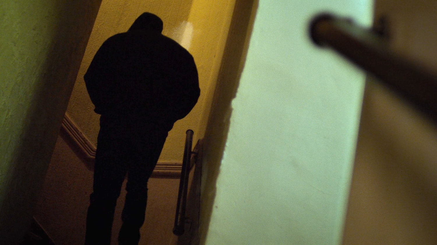 Luke walks up Cole Miller's apartment steps.
