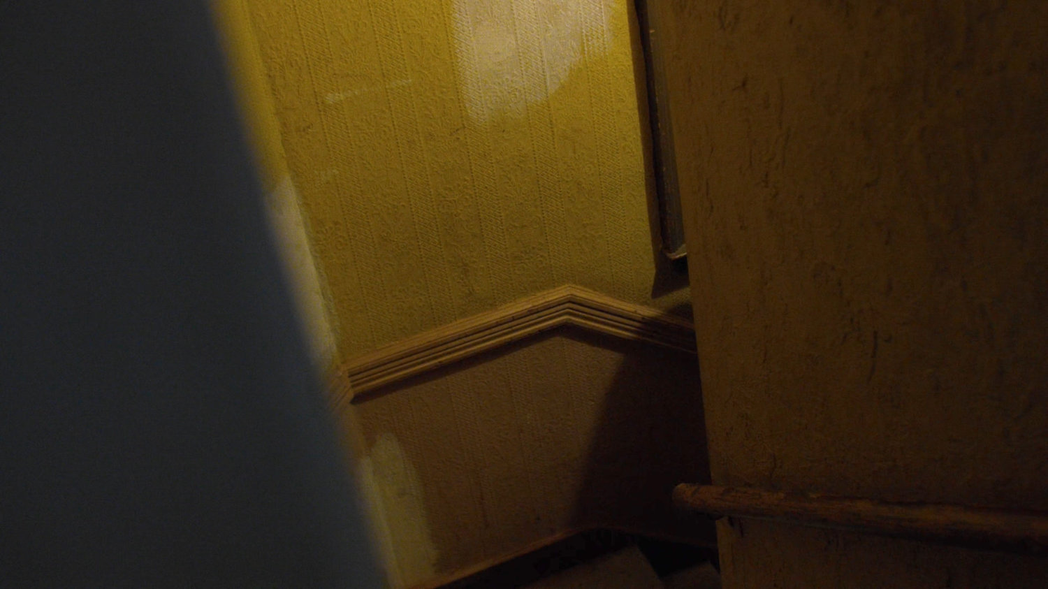 Luke walks up Cole Miller's apartment steps.