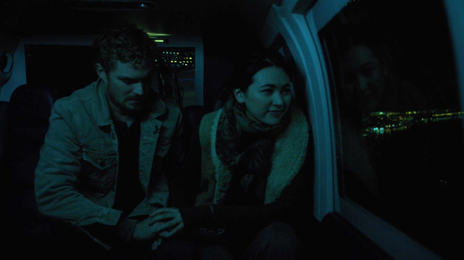 Danny and Colleen in helicopter at night flying over new York City.
