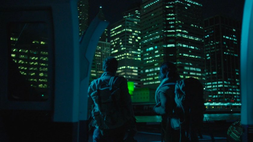Colleen and Danny look at the skyscrapers from a city heliport.