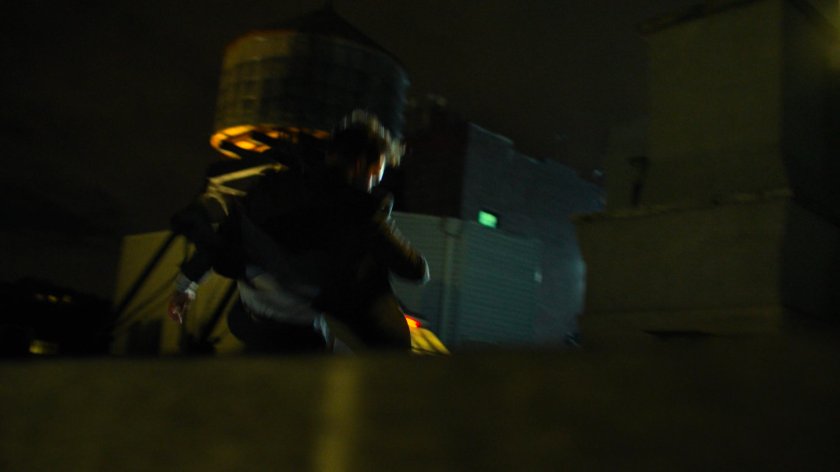 Matt running across his rooftop.