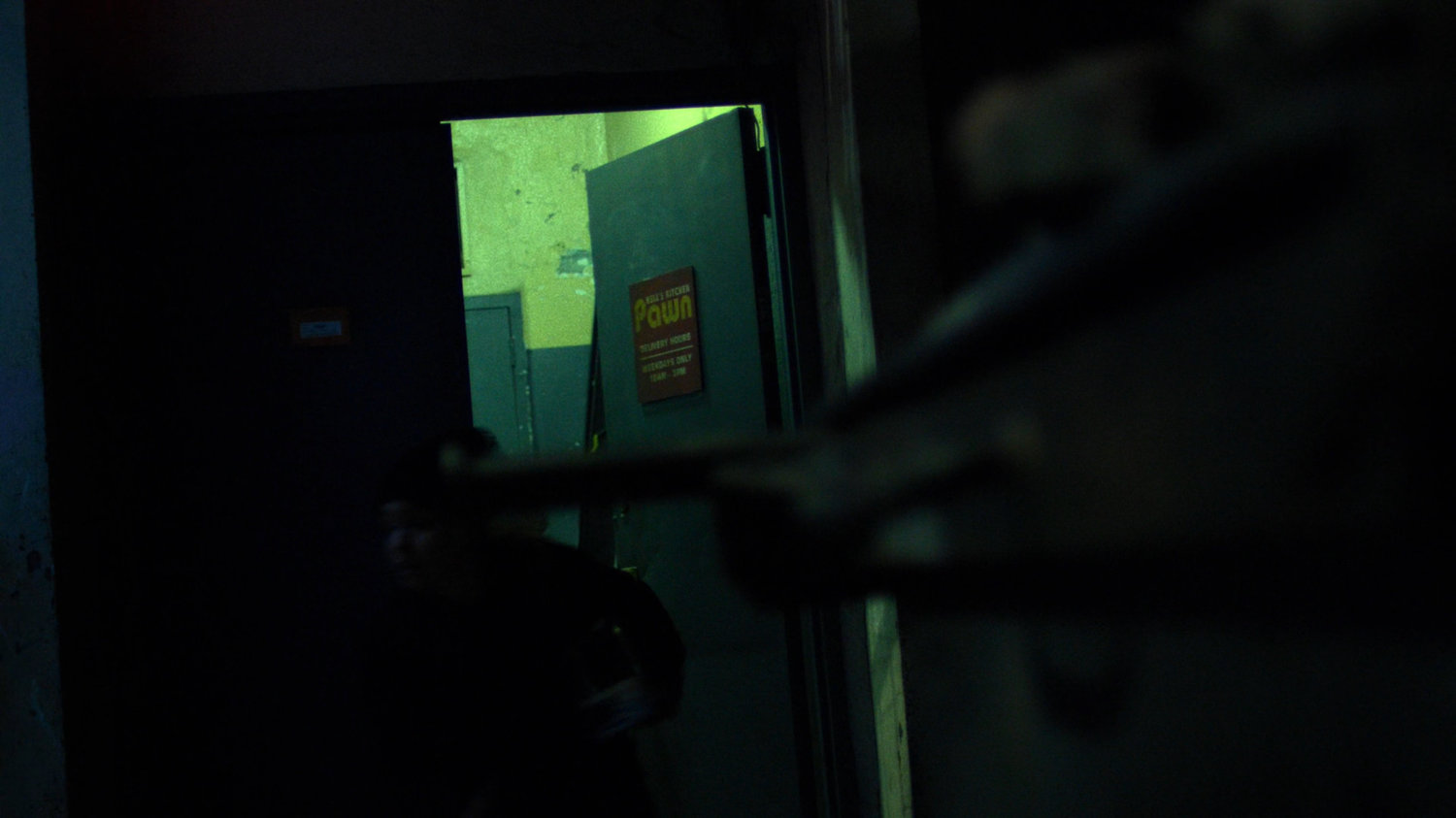 Exit door to the Hell's Kitchen Pawn shop.