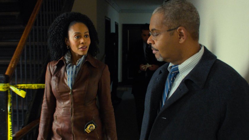 Misty Knight and Captain Strieber in John Raymond's motel hallway.