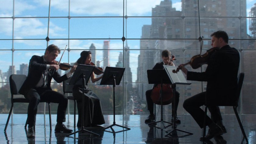 A string quartet performs in a space above Columbus Circle.