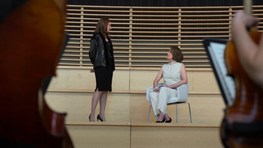 Sandra stands by Alexandra in concert space above Columbus Circle.