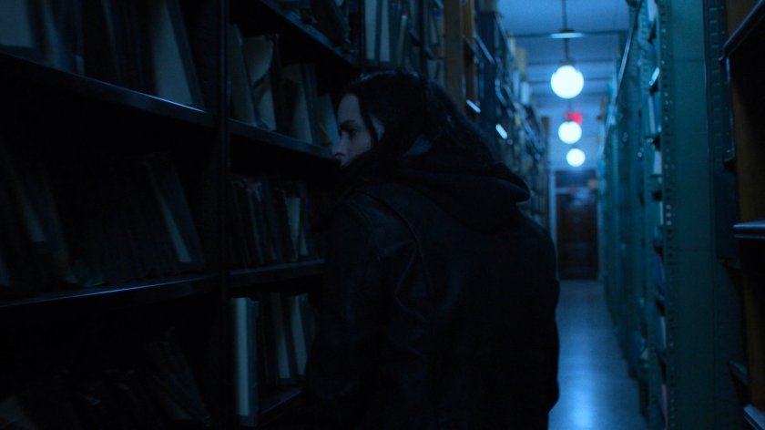 Jessica looks through records in the New York Archives.