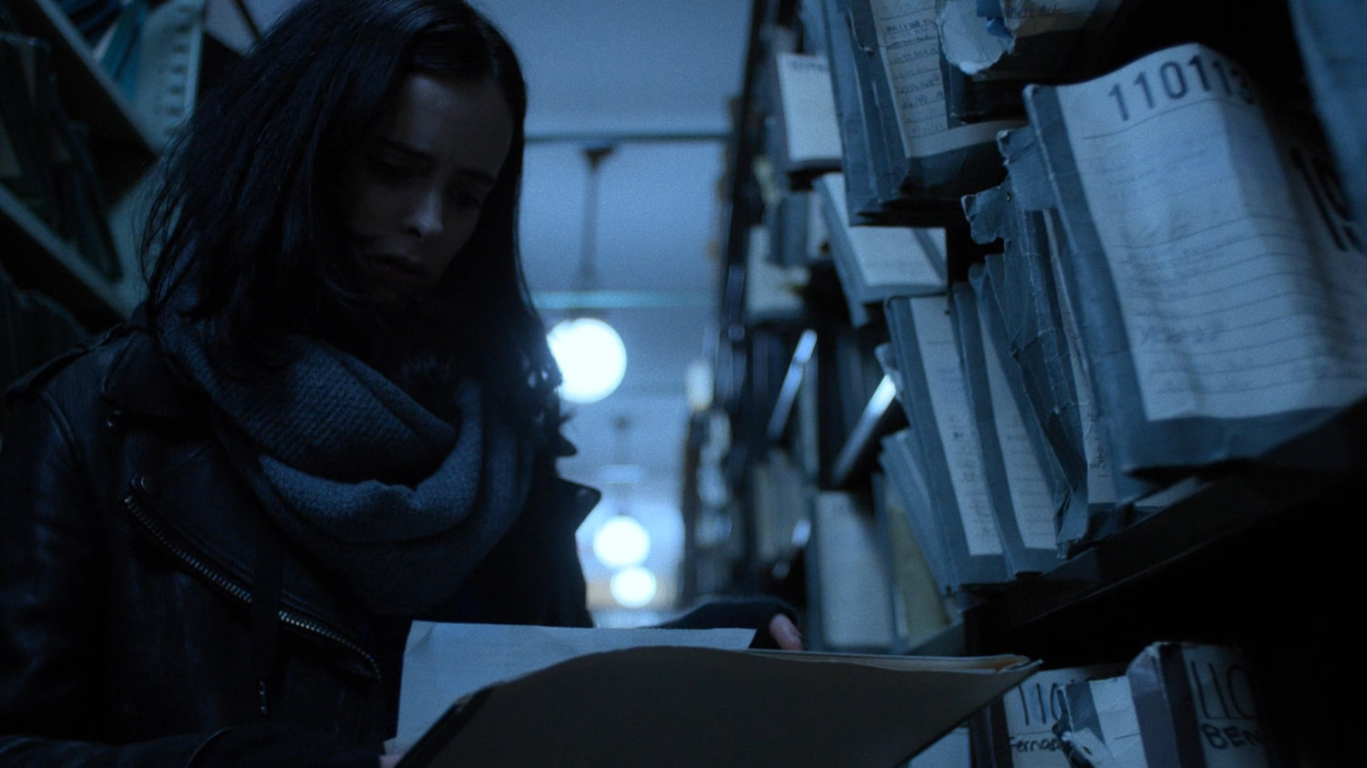 Jessica looks through records in the New York Archives.