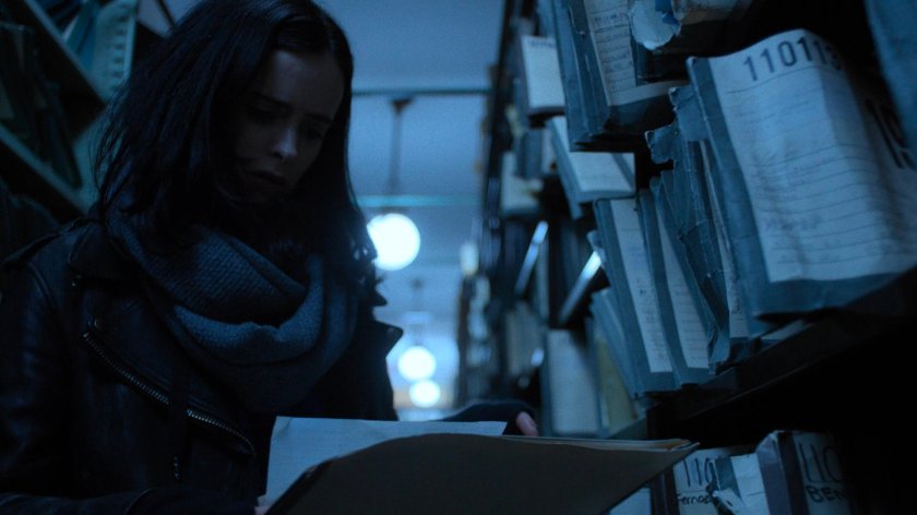Jessica looks through records in the New York Archives.