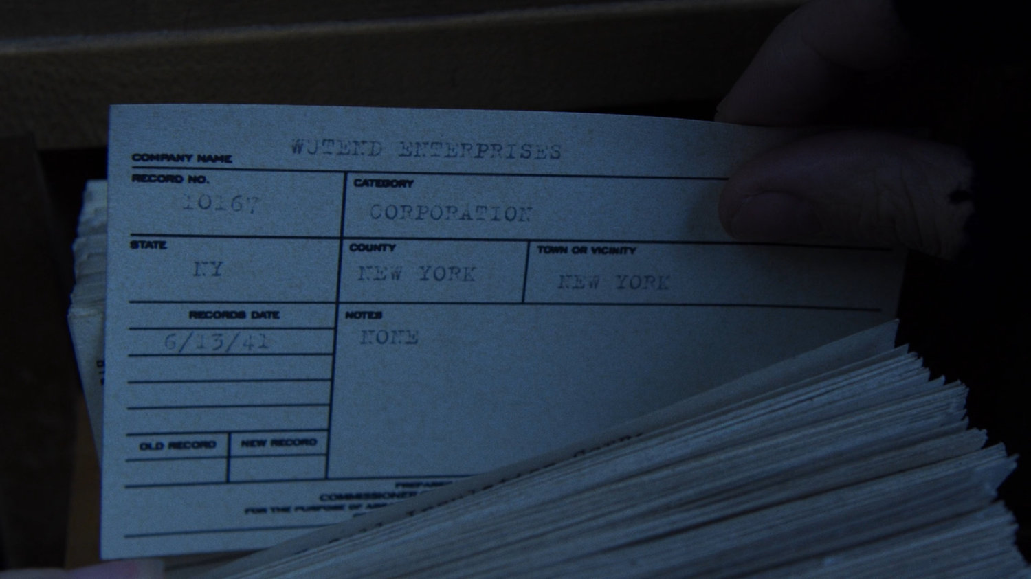 Close-up of card for Wütend Enterprises in the New York Archives.