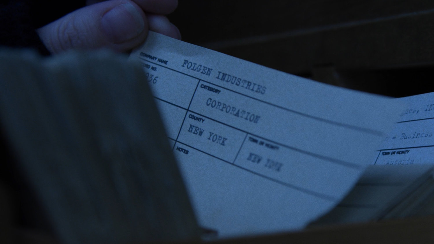 Close-up of card for Folgen Industries in the New York Archives.