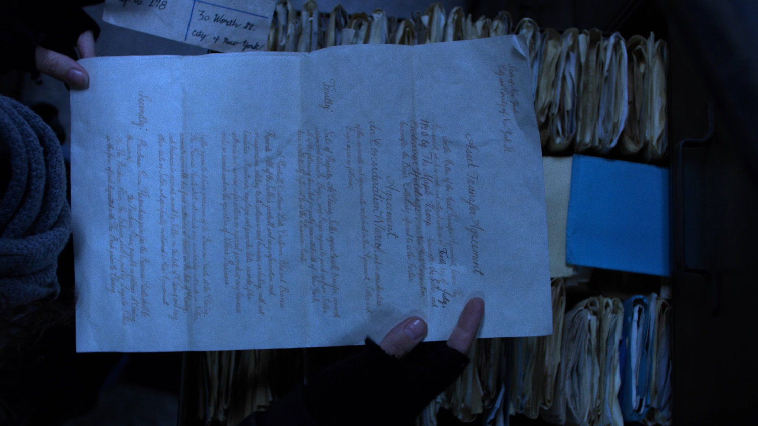 Close-up of old timey letter for Asset Transfer Agreement in the New York Archives.