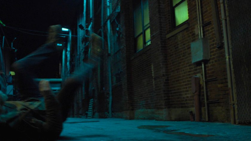 Danny flies into the alley behind the Tsukamoto workshop.