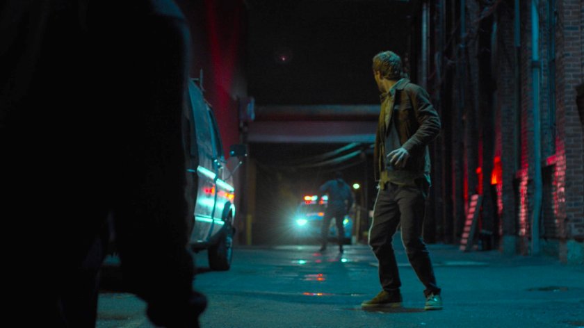 The police entering the alley behind Danny behind the Tsukamoto workshop.