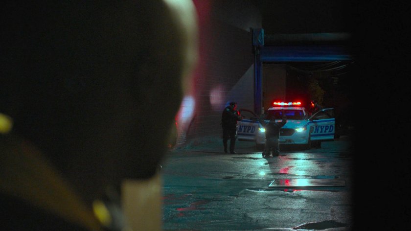 Luke watches Cole get arrested by police in alley behind the Tsukamoto workshop.